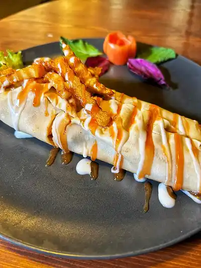 Chicken tikka wrap with sauces