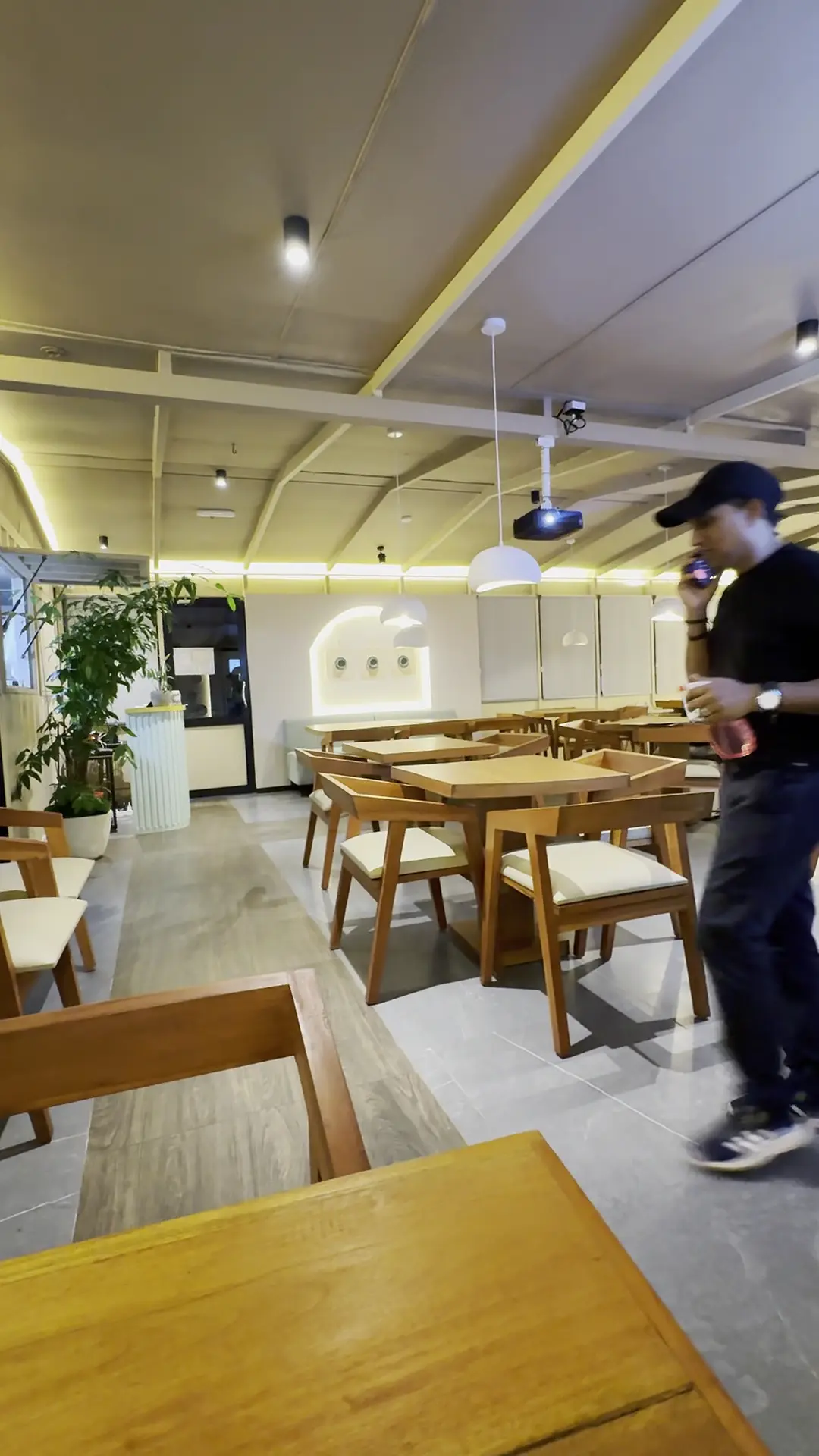 Bright dining room at The Octa with wooden tables and chairs