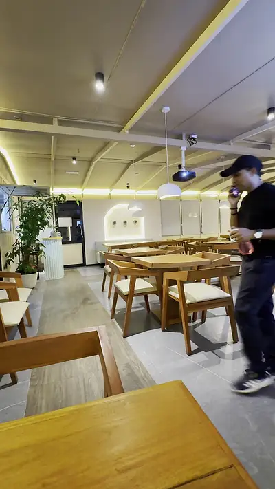 Bright dining room at The Octa with wooden tables and chairs
