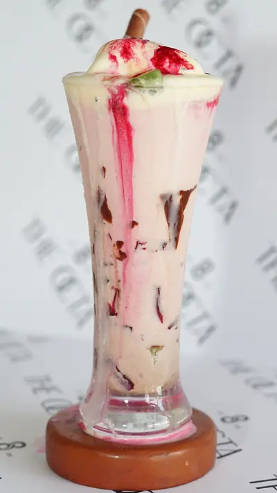 Faluda shake with rose syrup in a tall glass