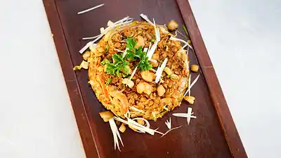 Fried rice plated on a wooden board