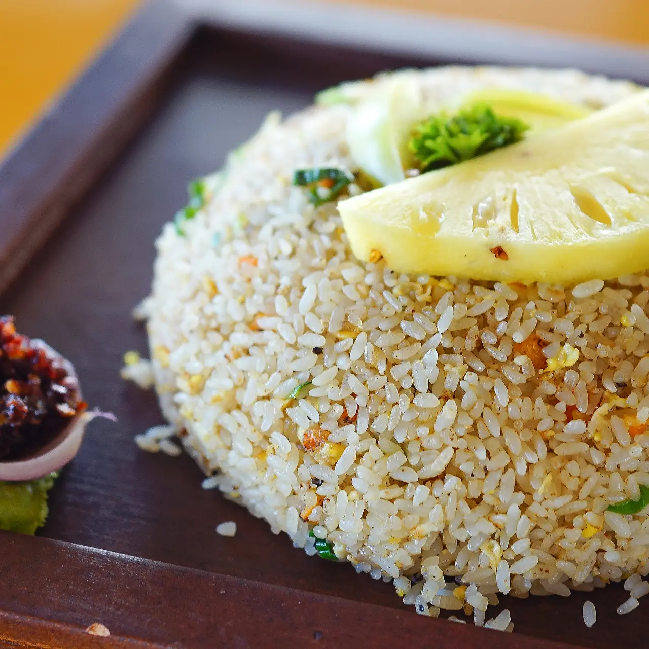 Fried rice topped with pineapple