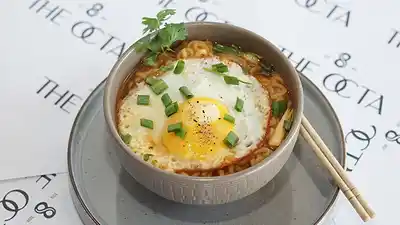 Spicy ramen with a soft egg and spring onions