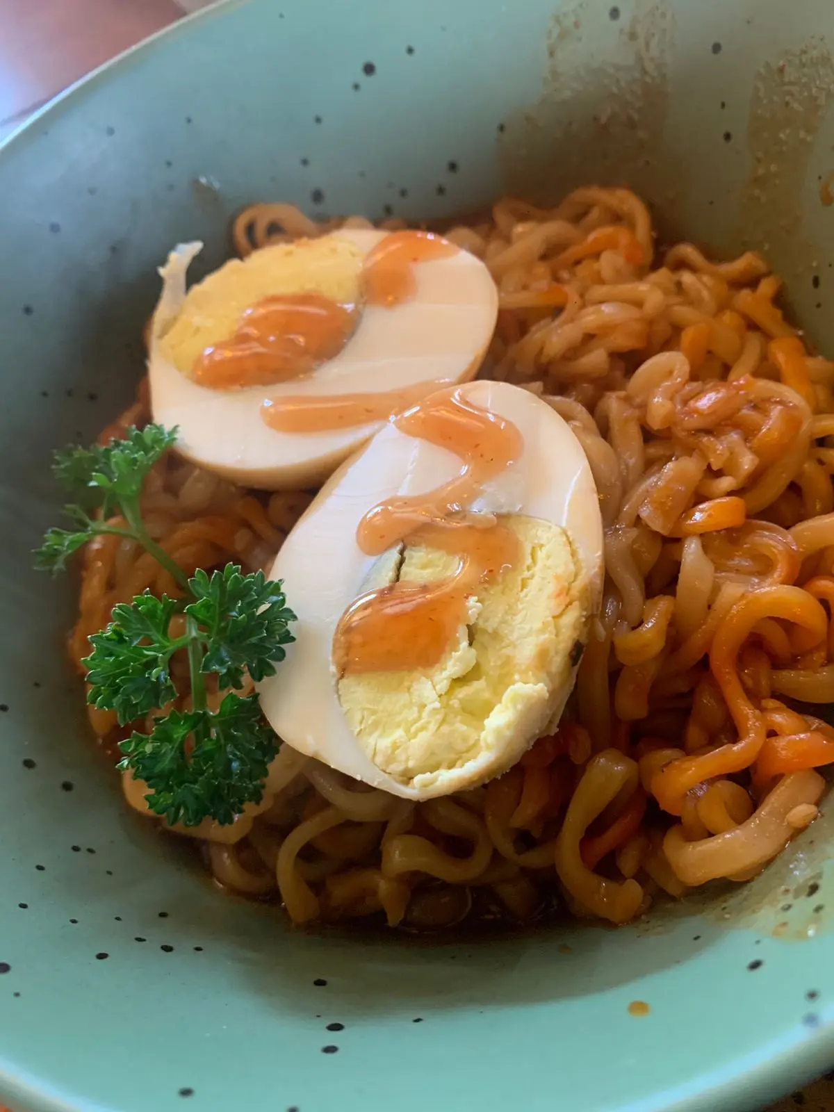Cheese buldak ramen with boiled eggs, photographed by a guest