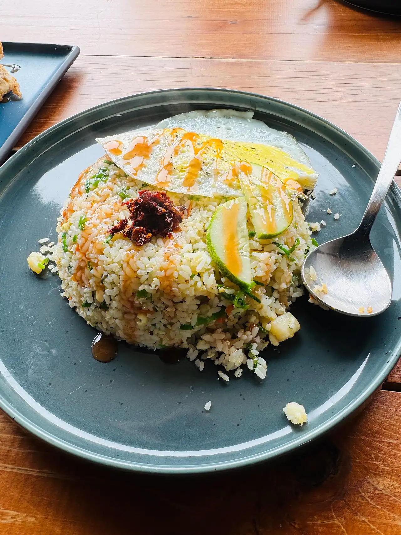 Fried rice with a fried egg and chilli paste, photographed by a guest