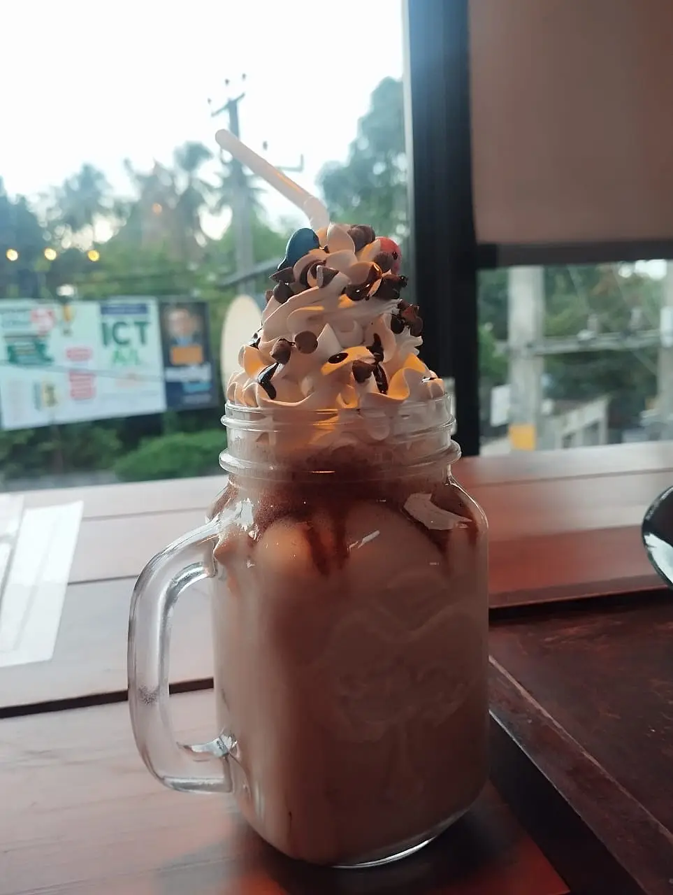 Chocolate milkshake in a mason jar, photographed by a guest