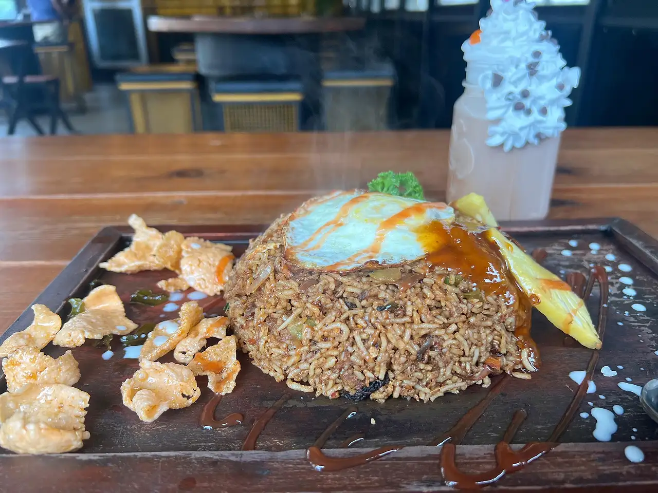 Nasi goreng with prawn crackers and a fried egg, photographed by a guest