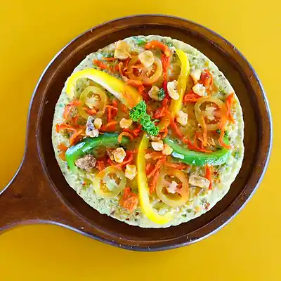 Sri Lankan spicy omelette with peppers in a skillet