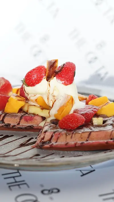 Waffle with strawberries and ice cream