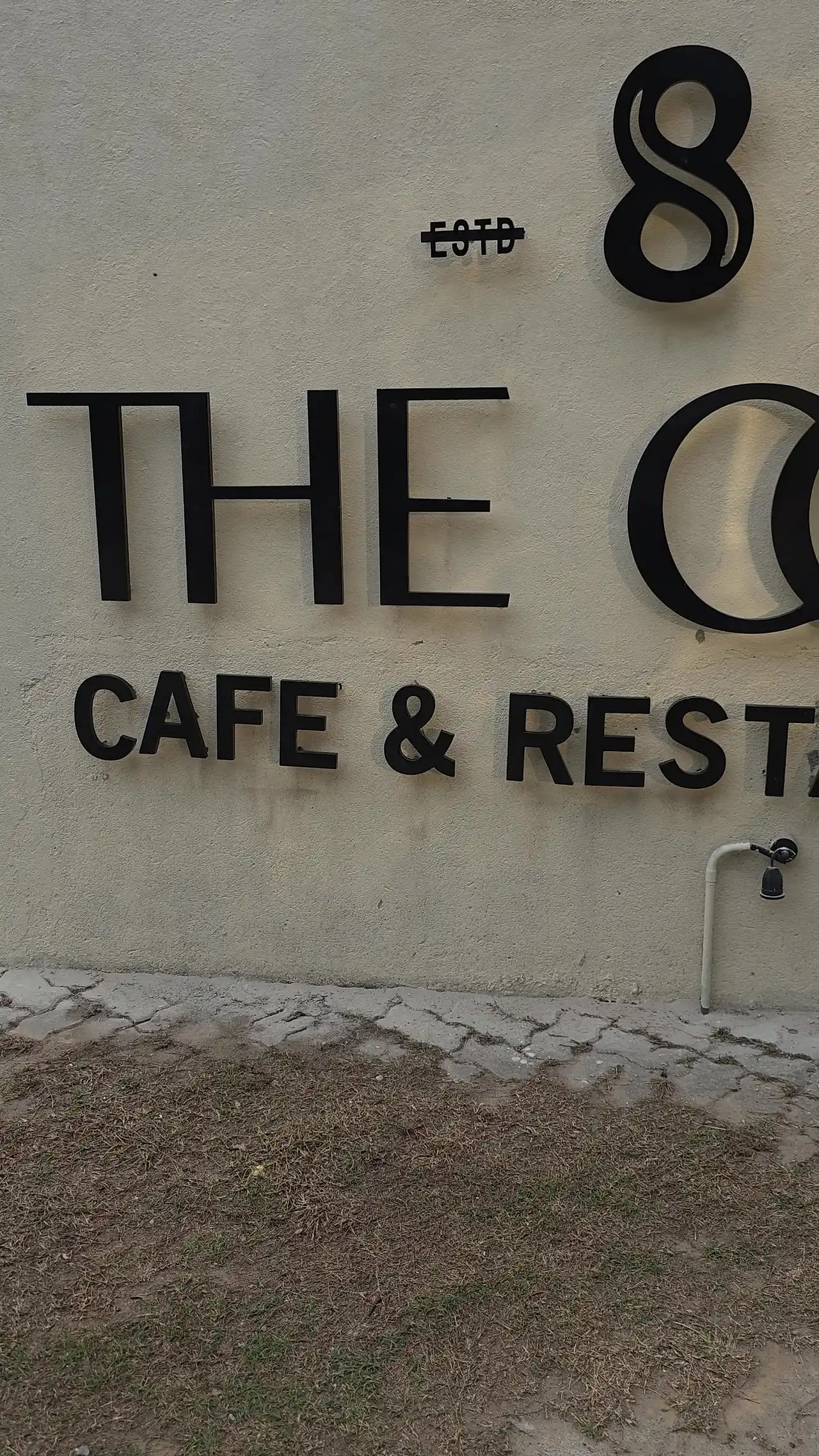 The Octa cafe and restaurant sign on the wall